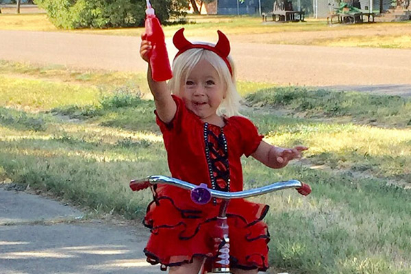 Girl Riding Bike In Red Dress